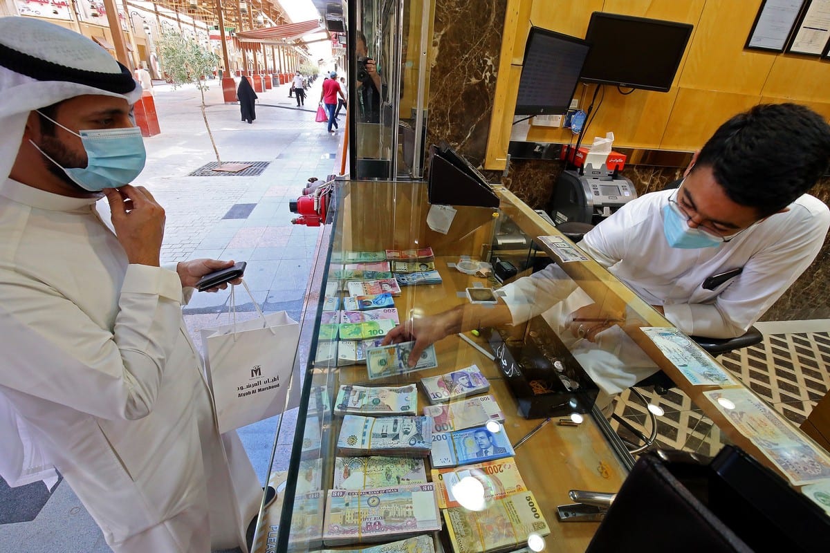 A Kuwaiti man stops at a currency exchange shop in Kuwait City on 7 September 2020 [YASSER AL-ZAYYAT/AFP/Getty Images]