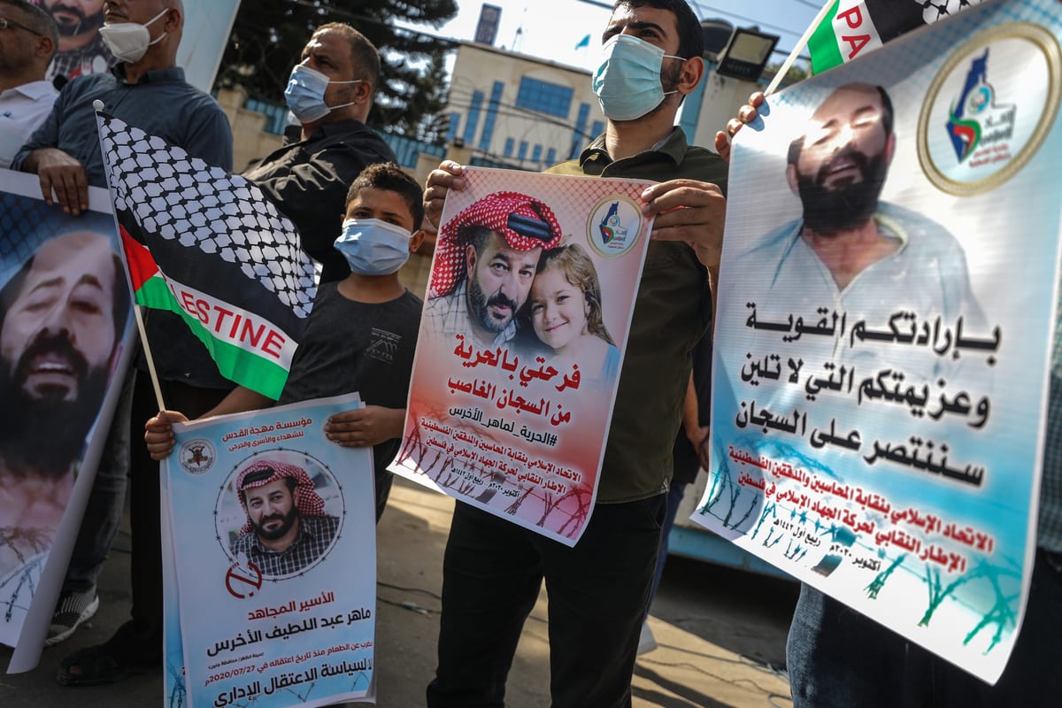 People gather in Gaza to support Maher Al-Akhras, a Palestinian detainee on hunger strike on 23 October 2020 [Ali Jadallah/Anadolu Agency]