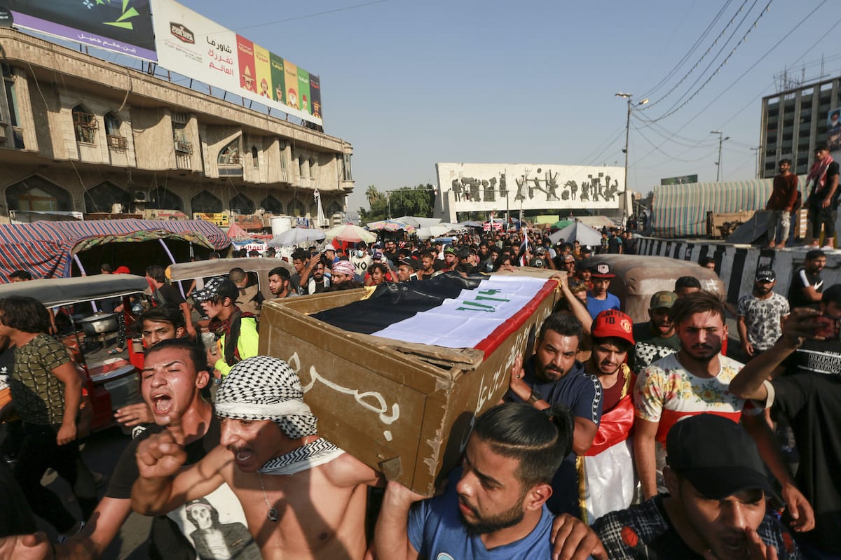 BAGHDAD, IRAQ OCTOBER 26 Iraqi people carry the coffin of a