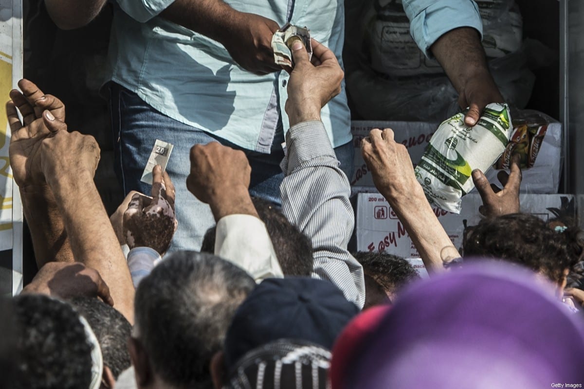 Egyptians buy sugar from a truck in the capital Cairo on October 26, 2016 [ KHALED DESOUKI/AFP via Getty Images]