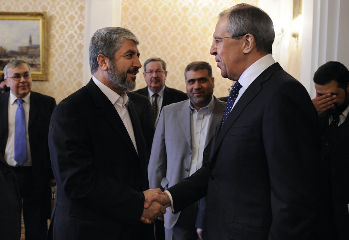 Russian Foreign Minister Sergei Lavrov (R) shakes hands with exiled Hamas leader Khaled Meshaal (L) in Moscow on February 8, 2010. [NATALIA KOLESNIKOVA/AFP via Getty Images]