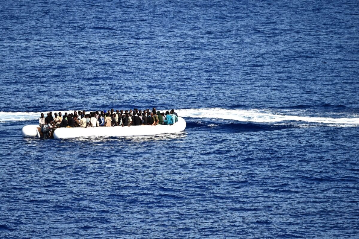 Migrants and refugees, mainly from Nigeria, Ghana, Senegal and Sierra Leone, wait to be rescued at sea and transported to the German navy frigate ship Werra, a part of the European external action service Eunavfor-med, on September 27, 2015. Eunavfor-med undertakes systematic efforts to identify, capture and dispose of vessels as well as enabling assets used or suspected of being used by migrant smugglers or traffickers in the southern central Mediteranean. AFP PHOTO / ALBERTO PIZZOLI (Photo credit should read ALBERTO PIZZOLI/AFP via Getty Images)