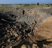 A small crater is seen after Israeli fighter jets carried out attack to a checkpoint in Dier al-Balah, Gaza on December 26, 2020 [Ashraf Amra / Anadolu Agency]