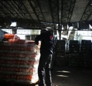 Damage to a soft drinks warehouse, seen after Israeli fighter jets attacked Gaza City, Gaza on December 26, 2020 [Mohammad Asad / Middle East Monitor]
