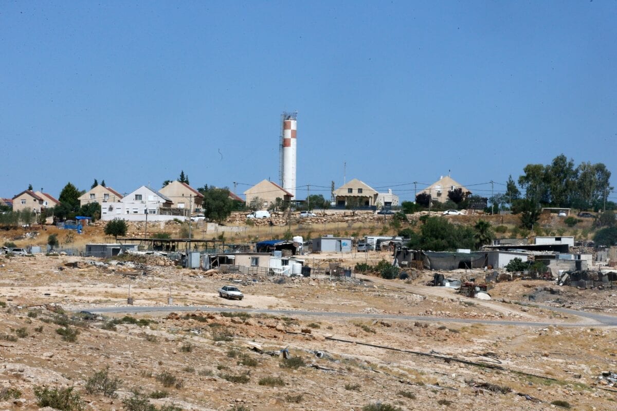 Tents and shacks used as habitats by Palestinians are pictured in the village of Um al-Kheir in &quot;area C&quot;, in front of the Jewish settlement of Karmiel, near the occupied West Bank city of Hebron, on June 14, 2020. - Israel intends to annex West Bank settlements and the Jordan Valley, as proposed by US President Donald Trump, with initial steps slated to begin from July 1. &quot;Area C&quot; is a stretch of land accounting for 60 percent of the West Bank over which Israel has control under the terms of the Oslo Accords signed between Israel and the Palestinians in the 1990s. It is extremely difficult for Palestinians to receive building permits from Israeli authorities for that area. (Photo by HAZEM BADER / AFP) (Photo by HAZEM BADER/AFP via Getty Images)