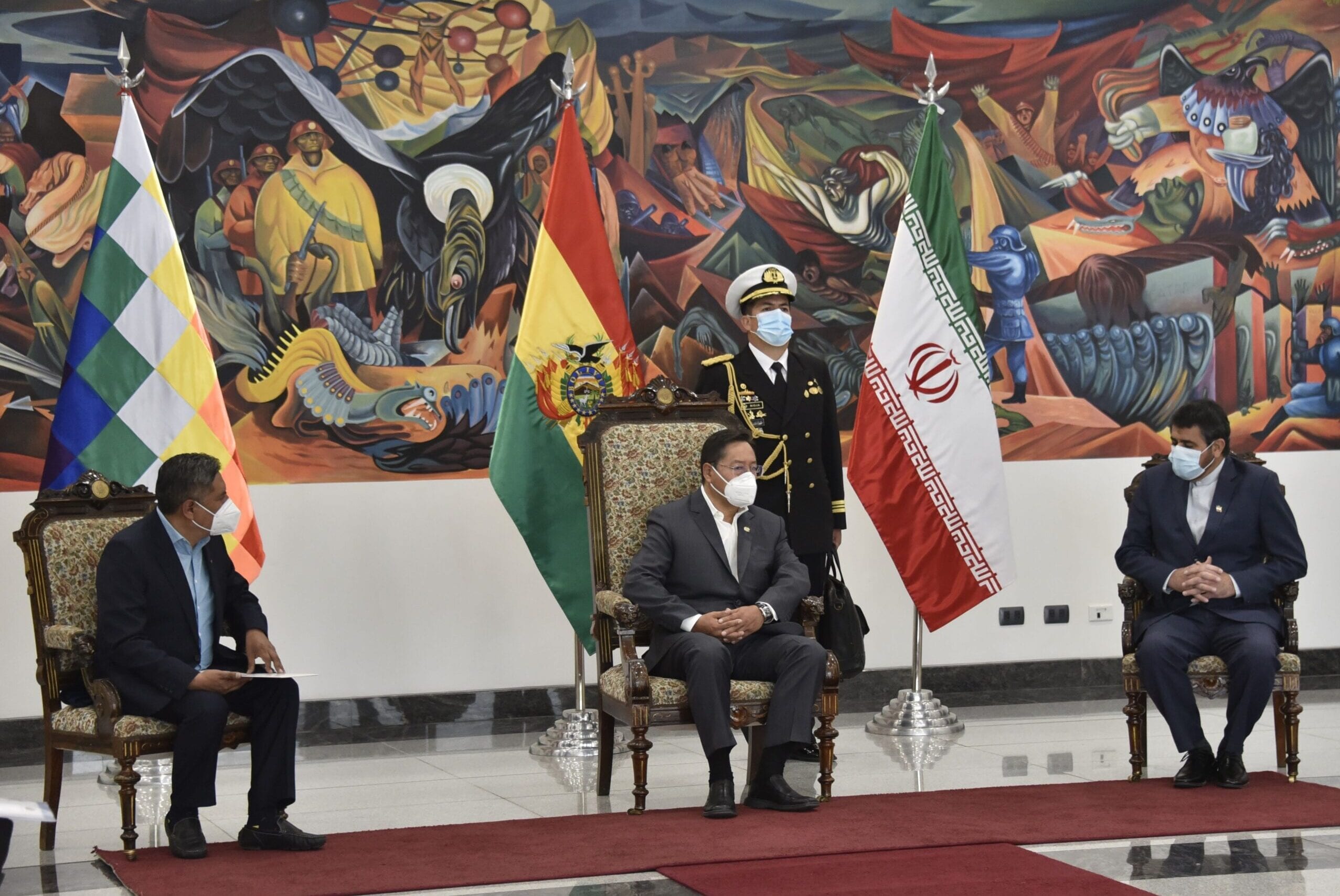 Bolivian President Luis Arce (C) and Foreign Minister Rogelio Mayta (L) talk with Iran's new ambassador to Bolivia, Mortessa Tabreshi, during the credentials ceremony in La Paz, on November 11, 2020. (Photo by Aizar RALDES / AFP) (Photo by AIZAR RALDES/AFP via Getty Images)