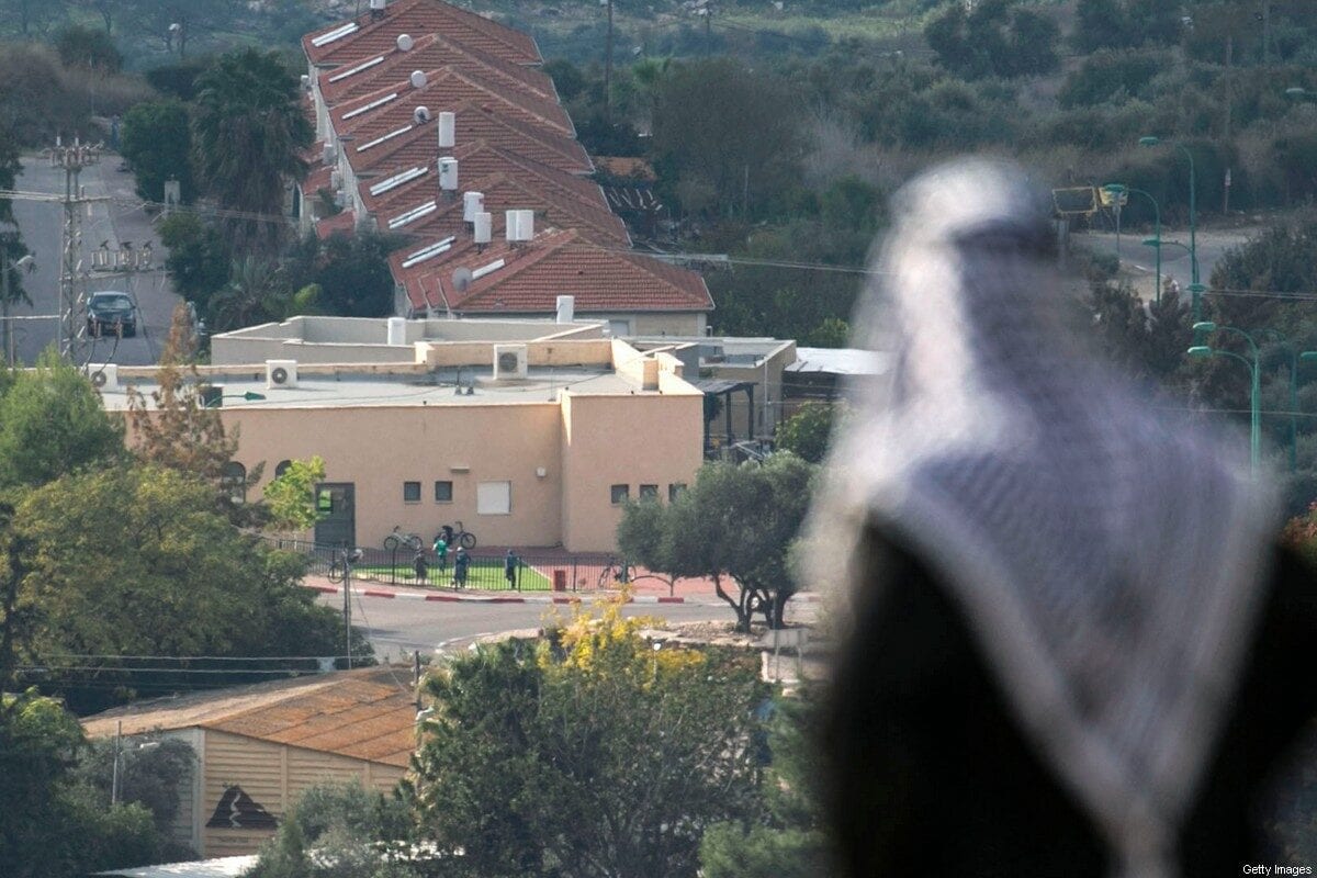 A Palestinian man looks towards the Israeli settlement of Shavei Shomron built next to the Palestinian village of Naqoura, west of Nablus in the occupied West Bank, on November 23, 2020. (Photo by JAAFAR ASHTIYEH / AFP) (Photo by JAAFAR ASHTIYEH/AFP via Getty Images)