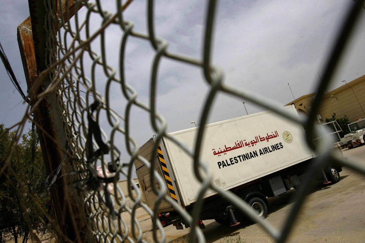 RAFAH, -: A lorry belonging to the Palestinian Airlines stands idle in the grounds of the Gaza International Airport, 29 April 2006. Not only have no planes landed for more than five years, but neither have any pay cheques for the last two months. At Gaza's ghost town airport, time stands still rather than flies. AFP PHOTO/Samuel ARANDA (Photo credit should read SAMUEL ARANDA/AFP via Getty Images)