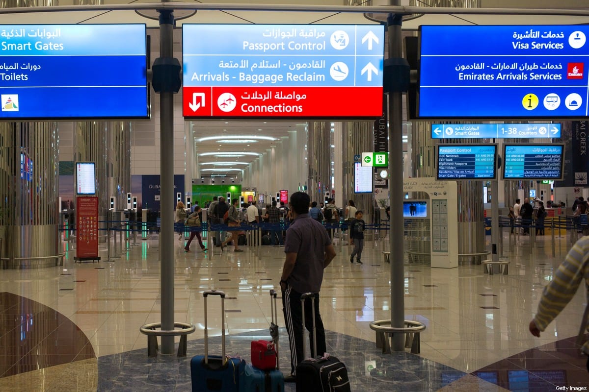 Airline travelers wait to clear immigration control at the Dubai International Airport in the United Arab Emirates on August 25, 2016. (Photo by Robert Nickelsberg/Getty Images)