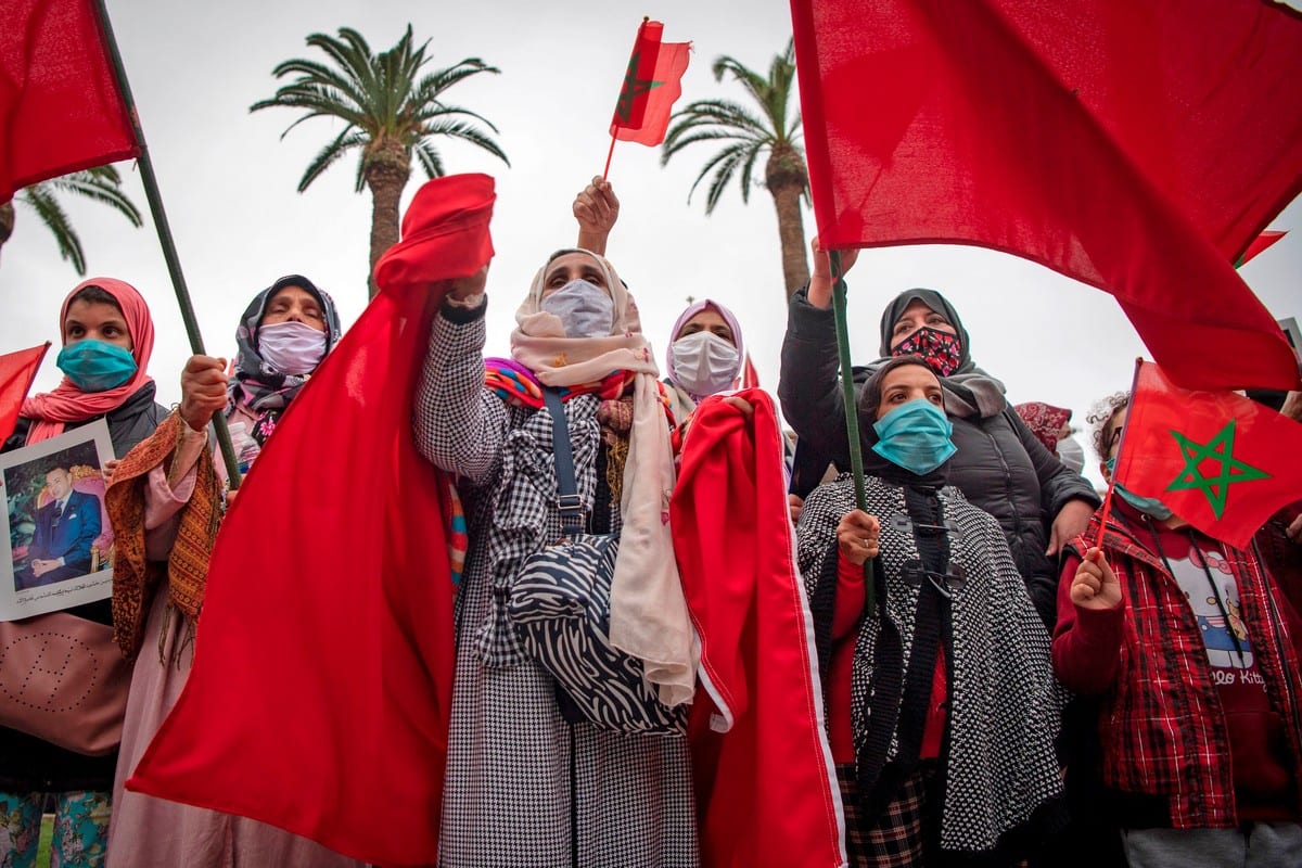 Moroccans celebrate after the US adopted a new official map of Morocco that includes the disputed territory of Western Sahara in Rabat, Morocco on 13 December 2020 [FADEL SENNA/AFP/Getty Images]