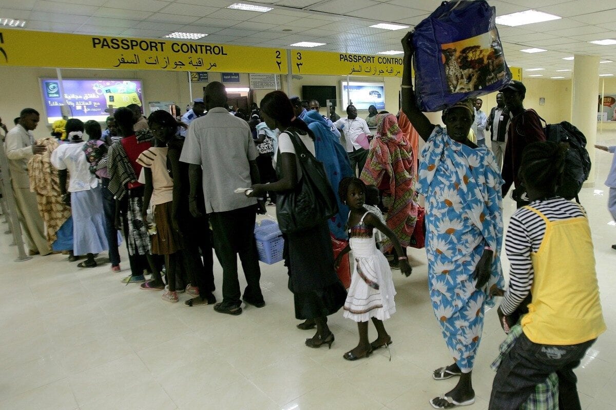 Sudanese queue at passport control at an the airport in Khartoum, Sudan on 14 May 2012 [ASHRAF SHAZLY/AFP/GettyImages]