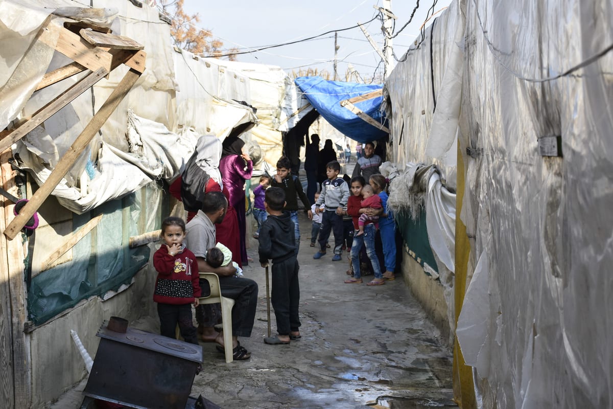 Syrian kids are seen in a refugee camp in Tripoli, Lebanon on 3 January 2021 [Mahmut Geldi/Anadolu Agency]