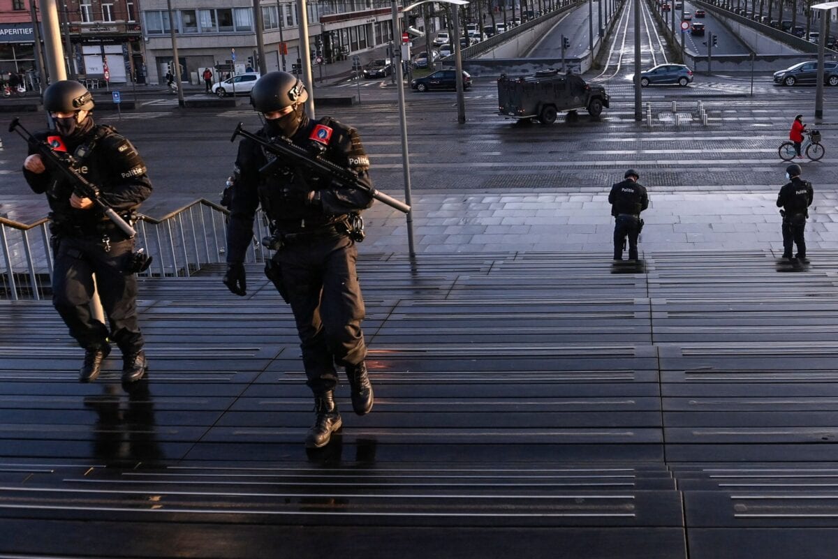 Heavily armed policemen patroll outside the courthouse during the trial of four persons including an Iranian diplomate and Belgian-Iranian couple before the Antwerp criminal court in Antwerp, on February 4, 2021. - A Belgian court returns a verdict on February 4, 2021, in the trial of an Iranian diplomat accused of plotting a bomb attack against opposition activists meeting in France. Assadollah Assadi, a 49-year-old formerly based in Vienna, faces up to 20 years in prison if convicted of plotting to target the June 30, 2018 rally. The gathering in Villepinte outside Paris included senior leaders of the exiled National Council of Resistance in Iran (NCRI) and some high-profile supporters. (Photo by DIRK WAEM / BELGA / AFP) / Belgium OUT (Photo by DIRK WAEM/BELGA/AFP via Getty Images)