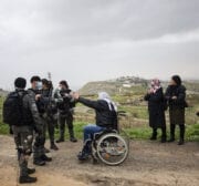 Israeli-run Jerusalem Municipality team along with Israeli soldiers and bulldozers demolish the house owned by a disabled Palestinian Hatim Abu Rayala (R), near the al-Issawiya neighborhood claiming that it was unlicensed, in East Jerusalem on 1 March 2021. [Mostafa Alkharouf - Anadolu Agency]