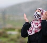 A woman reacts as Israeli-run Jerusalem Municipality team along with Israeli soldiers and bulldozers demolish the house owned by a disabled Palestinian Hatim Abu Rayala, near the al-Issawiya neighborhood claiming that it was unlicensed, in East Jerusalem on 1 March 2021. [Mostafa Alkharouf - Anadolu Agency]