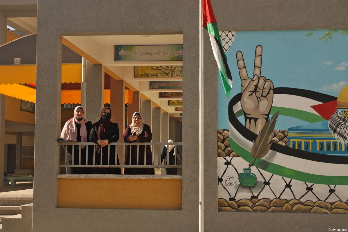 Palestinian teachers are pictured near the opening of the first Voter Information and Registration Centre in Gaza City on February 10, 2021. [MOHAMMED ABED/AFP via Getty Images]