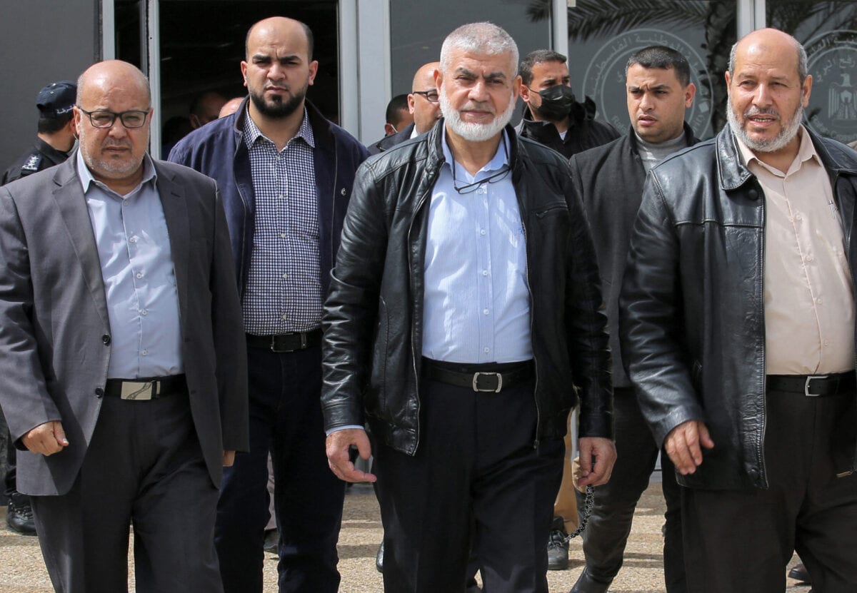 Hamas leaders Essam Aldalis (L) Rawhi Mushtaha (C) Khalil Al-Hayya (R) walk outside the VIP hall at the Rafah border crossing with Egypt in the southern Gaza Strip on March 15, 2021 [SAID KHATIB/AFP via Getty Images]