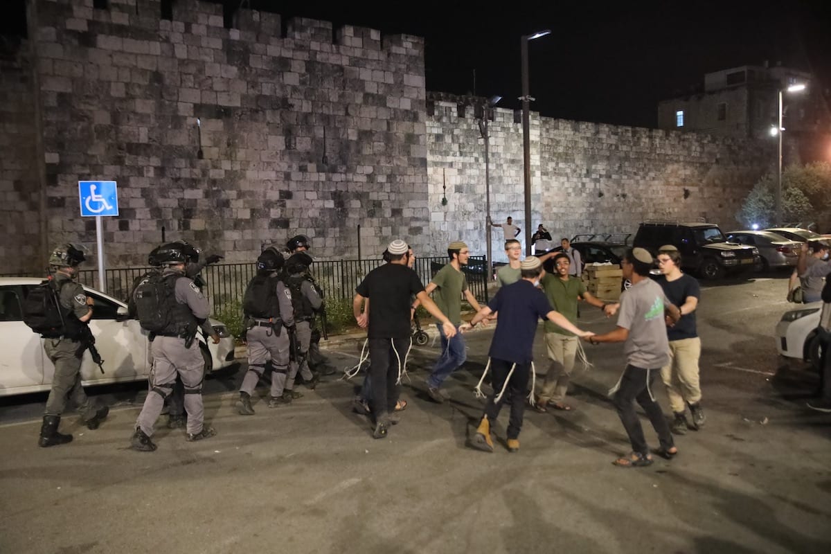 Israeli forces intervene Palestinian young Muslims, who gathered after performing Tarawih prayer, with water cannon vehicles and sound bombs and fanatic Jews arrive in Damascus Gate in Eastern Jerusalem on 18 April 2021. [Mostafa Alkharouf - Anadolu Agency]
