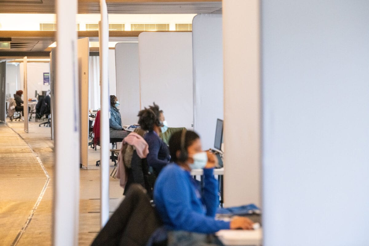 Call center workers on April 13, 2021 [Benjamin Girette/Bloomberg via Getty Image]