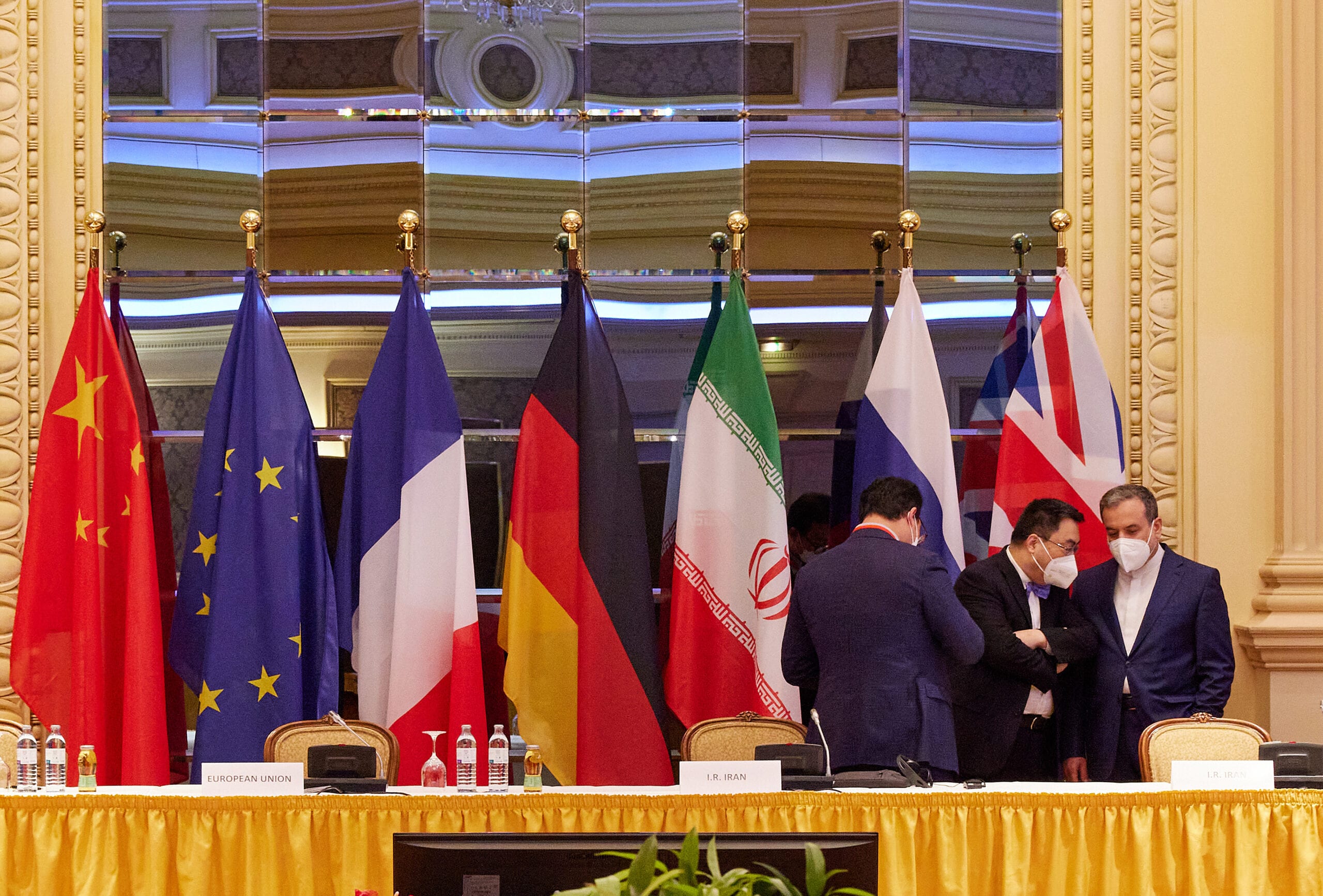 In this handout image provide by EU Delegation Vienna, Iranian Deputy Foreign Minister Abbas Araghchi (R) speaks with other participants at the JCPOA Iran nuclear talks on April 27, 2021 in Vienna, Austria [EU DELEGATION VIENNA via Getty Images]