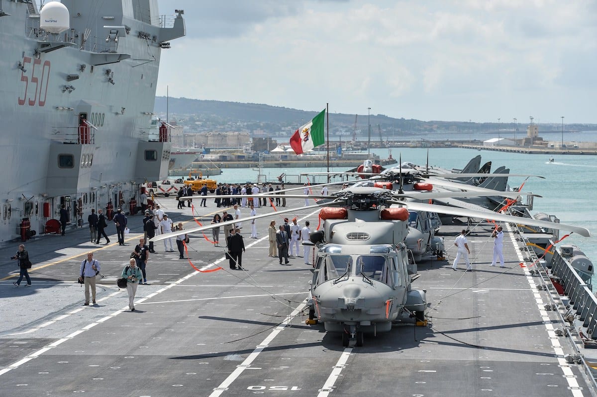 Harrier jets and helicopters are parked on the flight deck of the Italian navy's aircraft carrier "Cavour" in the Civitavecchia harbour on 8 July 2014. [ANDREAS SOLARO/AFP via Getty Images]