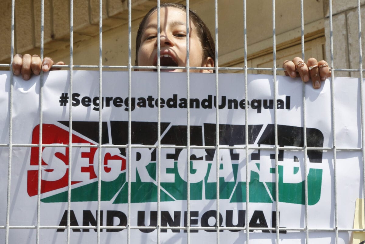 A girl shouts slogans during a demonstration organised by young Palestinians in Hebron on September 3, 2017, against a recent decision by Israel to boost the powers of the settlers in the occupied West Bank city [HAZEM BADER/AFP via Getty Images]