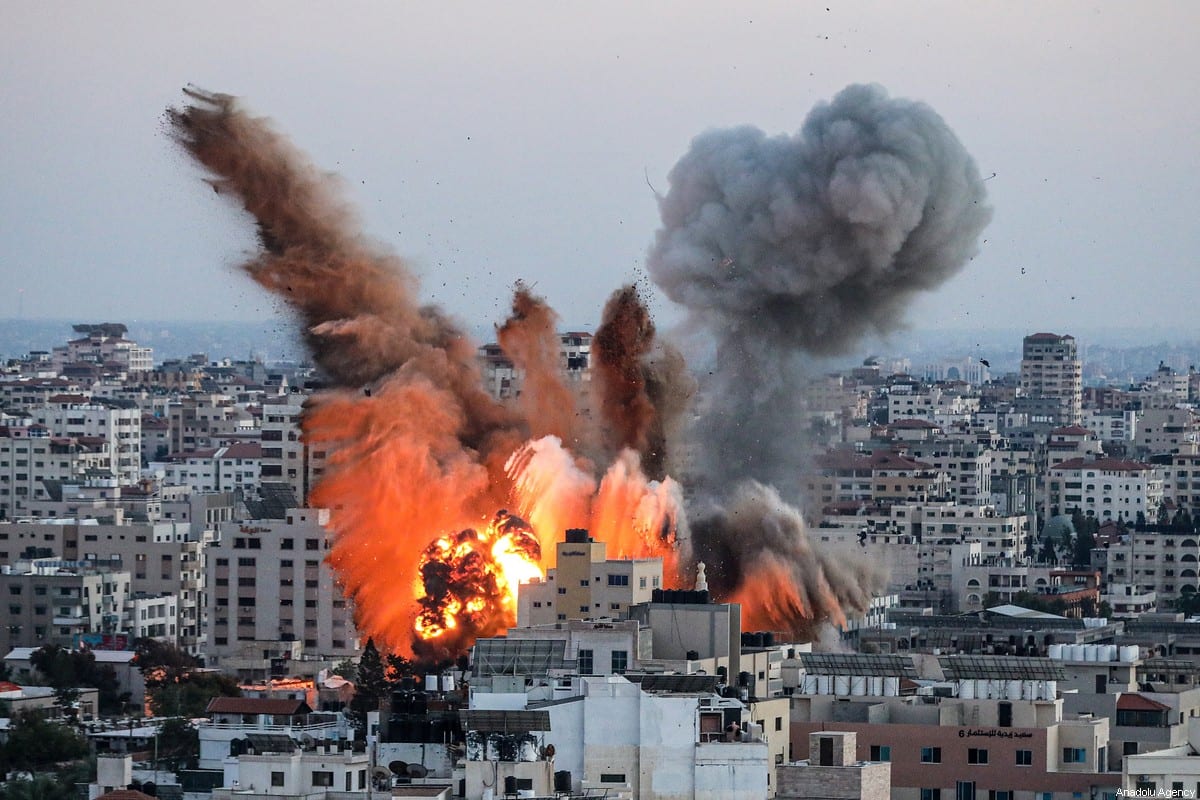 Smoke rises after airstrikes over Ansar Government Complex building in Gaza City, Gaza on May 14, 2021 [Ali Jadallah/Anadolu Agency]