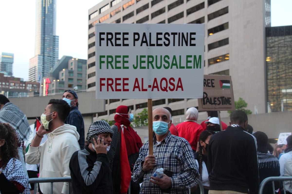 People gather to stage a demonstration in support of Palestinians and to protest against Israeli attacks on Gaza Strip and East Jerusalem on the 73rd Nakba Day at Nathan Phillips Square in Toronto, Canada on May 15, 2021. [Seyit Aydoğan - Anadolu Agency]