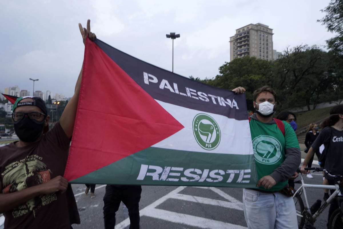 Protesters gathering at Rua Rui Barbosa in the Bela Vista neighborhood and marching to the Pacaembu Stadium with flags and banners, protest against Israeli attacks on Gaza Strip and East Jerusalem in Sao Paulo, Brazil on 16 May 2021. [Cristina Szucinski - Anadolu Agency]