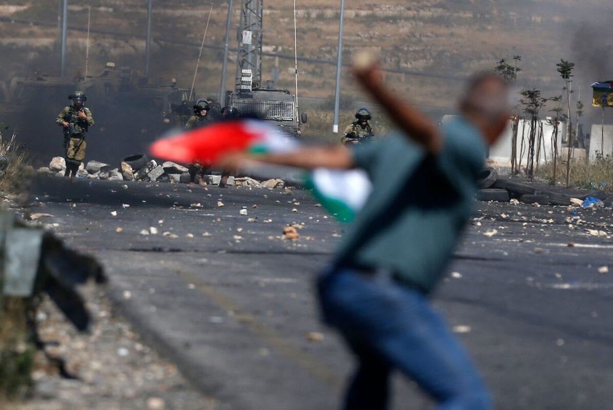A Palestinian demonstrator during demonstrations near the Jewish settlement of Beit El near Ramallah in the occupied West Bank on May 14, 2021. [ABBAS MOMANI/AFP via Getty Images]