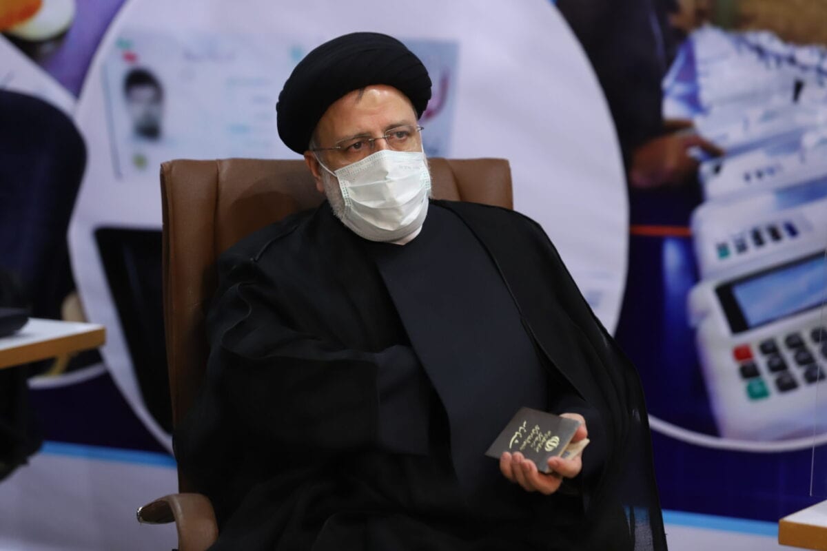Iranian judiciary chief Ebrahim Raisi greets journalists as he arrives to submit his candidacy for Iran's presidential elections, at the Interior Ministry ahead of the presidential elections scheduled for June on May 15, 2021, Tehran, Iran. (Photo by Majid Saeedi/Getty Images)