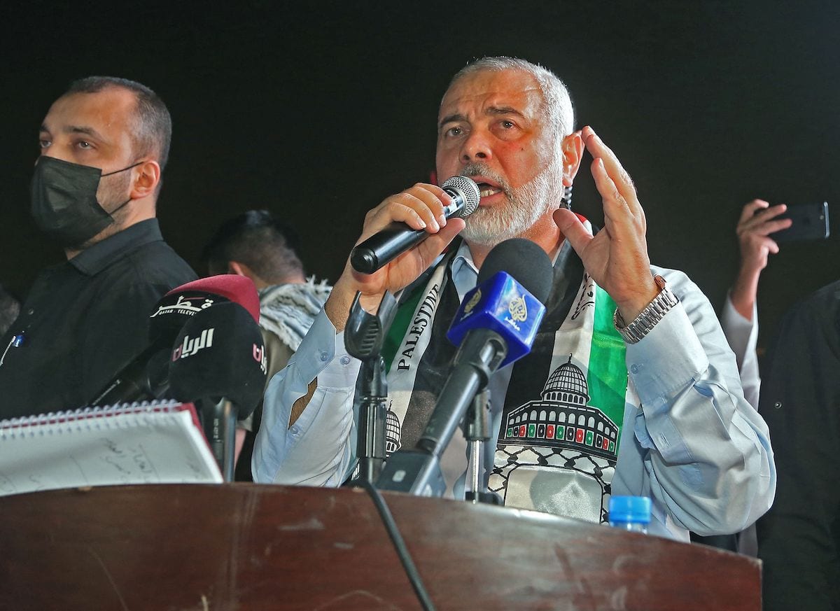 Hamas' political bureau chief Ismail Haniyeh addresses supporters during a rally in solidarity with the Palestinians outside Qatar's Imam Muhammad Abdel-Wahhab Mosque in the capital Doha on 15 May 2021. [KARIM JAAFAR/AFP via Getty Images]