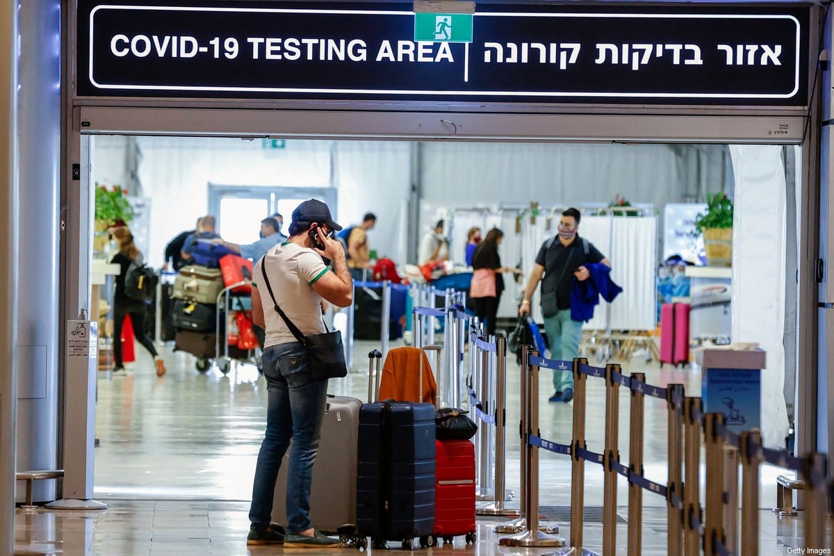 Tourists arrive to Israel's Ben Gurion Airport near Tel Aviv on May 23, 2021 [JACK GUEZ/AFP via Getty Images]