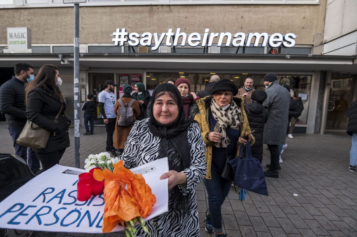 Relatives, friends and witnesses meet in front of and in the rooms of the victims' initiative 'saytheirnames' near the first crime scene at Heumarkt on the shooting's first anniversary on February 19, 2021 in Hanau, Germany [Thomas Lohnes/Getty Images]