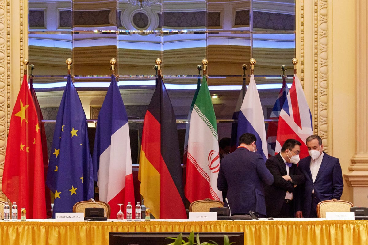 In this handout image provide by EU Delegation Vienna, Iranian Deputy Foreign Minister Abbas Araghchi (R) speaks with other participants at the JCPOA Iran nuclear talks on April 27, 2021 in Vienna, Austria [EU DELEGATION VIENNA via Getty Images]