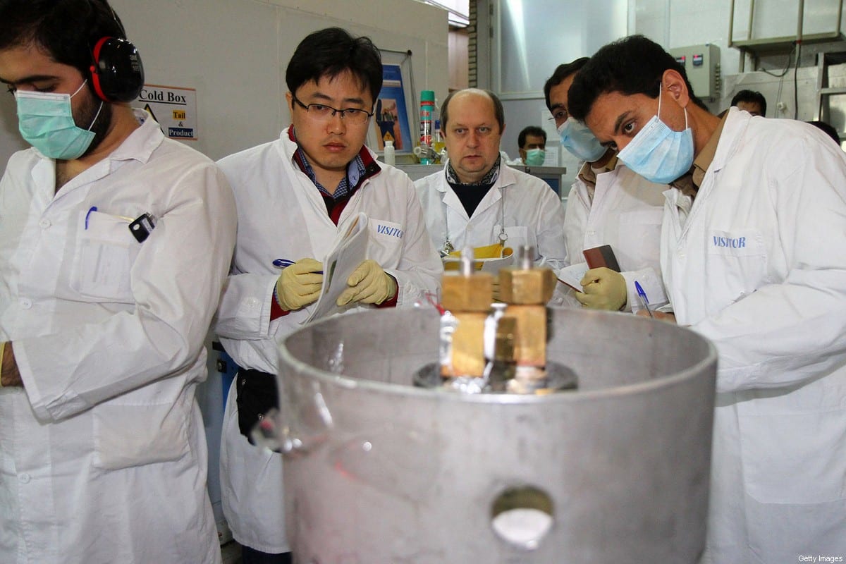 Unidentified International Atomic Energy Agency (IAEA) inspectors (2nd-3rd L) [KAZEM GHANE/IRNA/AFP via Getty Images]