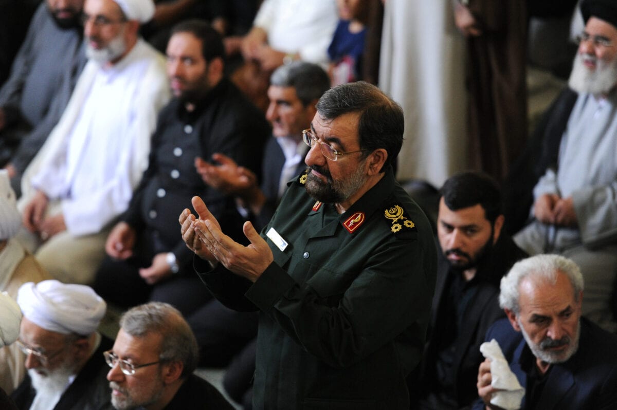 TEHRAN, IRAN - JULY 10: Mohsen Rezaei, a former Iranian Revolutionary Guard commander and two-time presidential candidate (in uniform), stands during Friday Prayers during a Qods (Jerusalem) Day rally, an annual pro-Palestinian event, in Tehran, Iran, on July 10, 2015. Rally-goers turned out in cities across Iran, chanting "Death to America" and "Death to Israel," as Iran negotiates the final rounds of a nuclear deal with six world powers in Vienna, Austria. (Photo by Scott Peterson/Getty Images)
