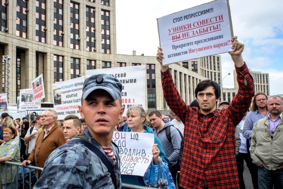 People hold posters during a rally in defence of freedom of speech and journalism in central Moscow on June 16, 2019 [YURI KADOBNOV/AFP via Getty Images]