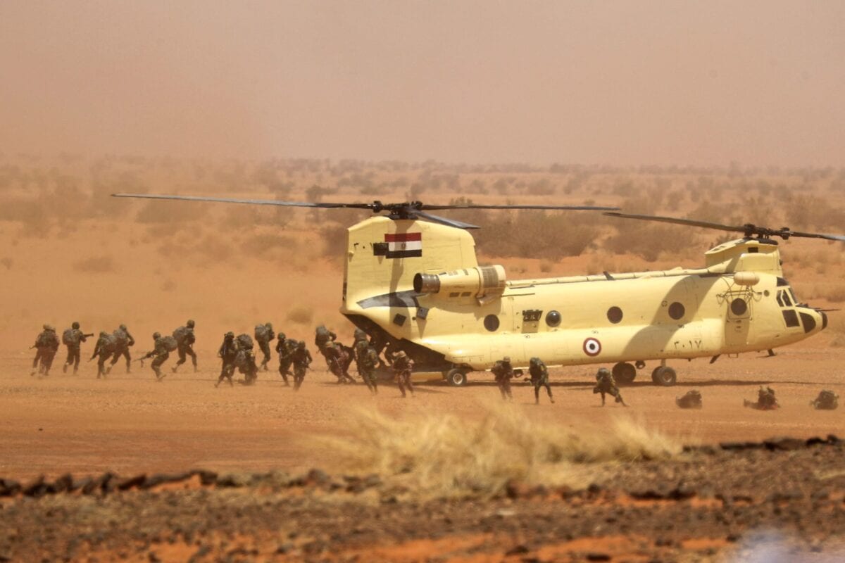 Soldiers disembark off an Egyptian Air Force CH-47 Chinook helicopter during the "Guardians of the Nile" joint military drill between Egypt and Sudan in the Um Sayyala area, northwest of Khartoum, on May 31, 2021. [ASHRAF SHAZLY/AFP via Getty Images]