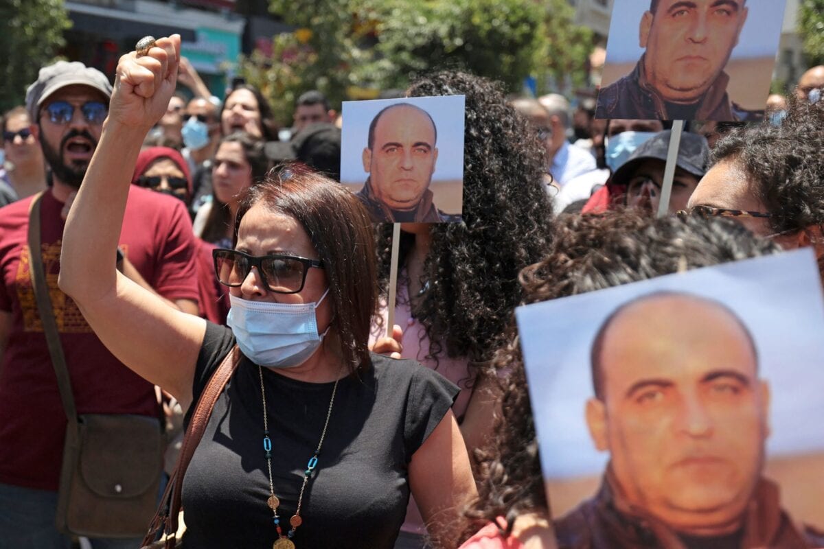 Protesters take part in a demonstration calling for Palestinian president Mahmud Abbas to quit in Ramallah in the occupied West Bank on June 24, 2021, following the death of Palestinian human rights activist Nizar Banat [ABBAS MOMANI/AFP via Getty Images]