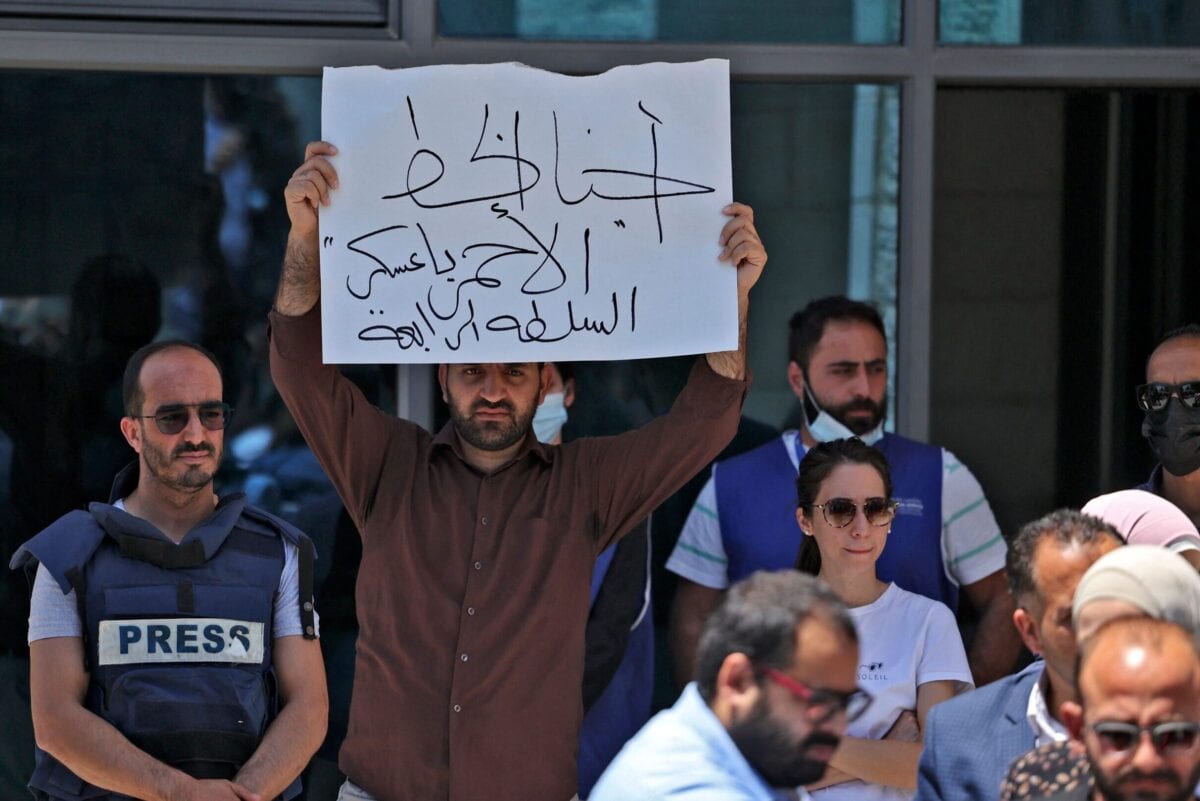 Journalists protest outside the United Nations office in the occupied West Bank city of Ramallah on June 28, 2021 [ABBAS MOMANI/AFP via Getty Images]