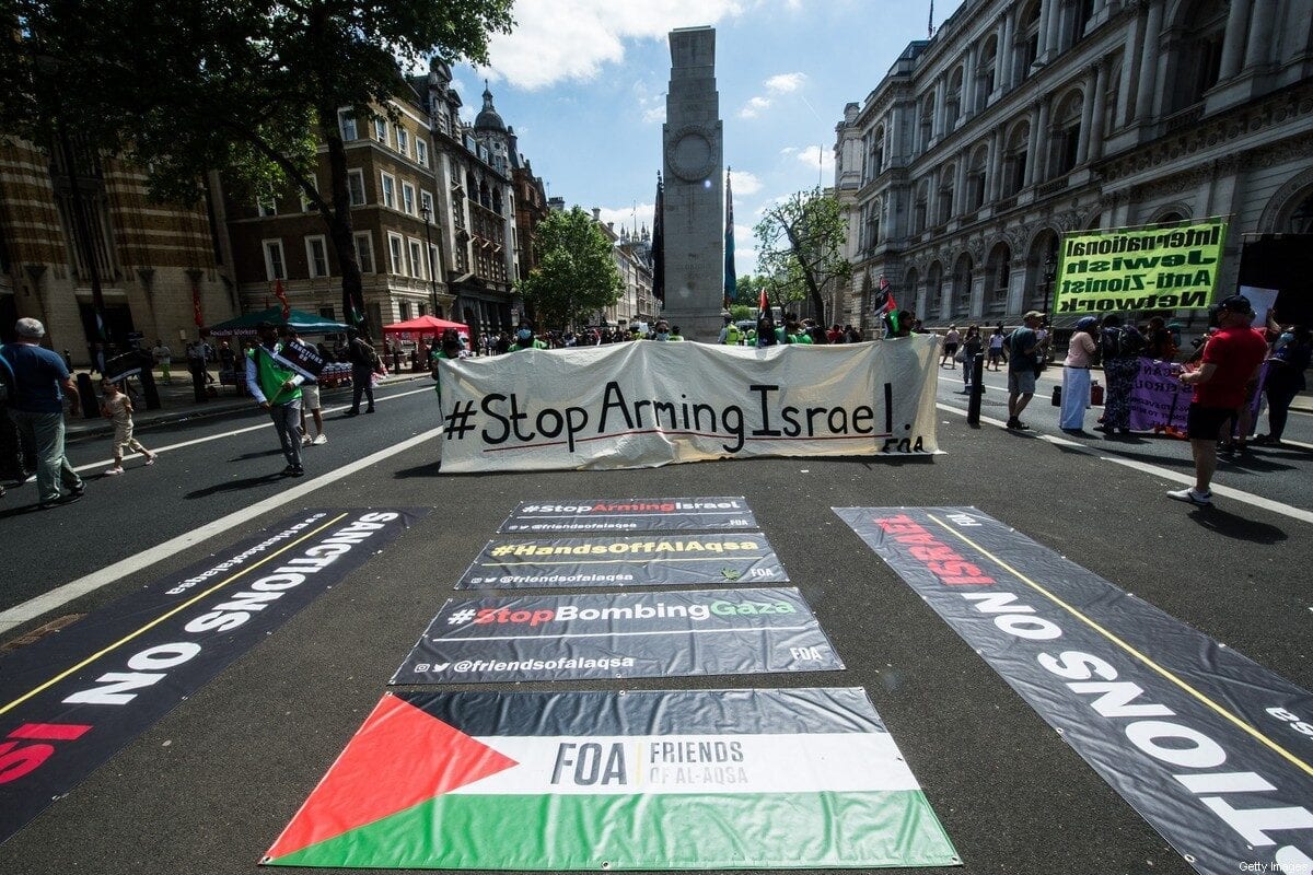Protest banners are laid on the road near Downing Street on June 12, 2021 in London, England. [Guy Smallman/Getty Images]