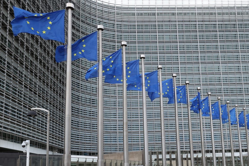 European Union flags are seen waving outside the EU Commission Building in Brussels, Belgium on July 6, 2021 [Dursun Aydemir/Anadolu Agency]