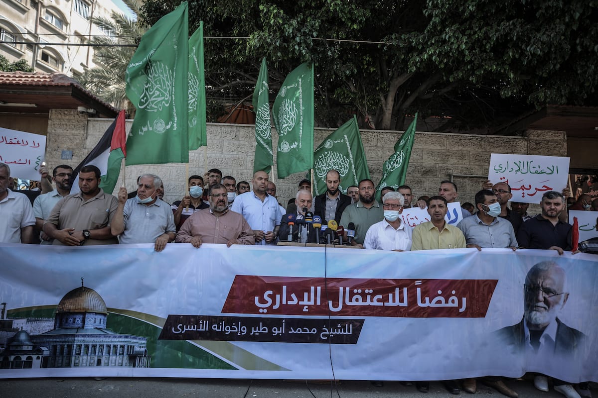 Mohammed al-Ghul (C), one of Hamas executives, makes a speech during a protest against Israeli policy of administrative detention in front of building of International Committee of the Red Cross (ICRC) in Gaza City, Gaza on July 12, 2021 [Ali Jadallah/Anadolu Agency]