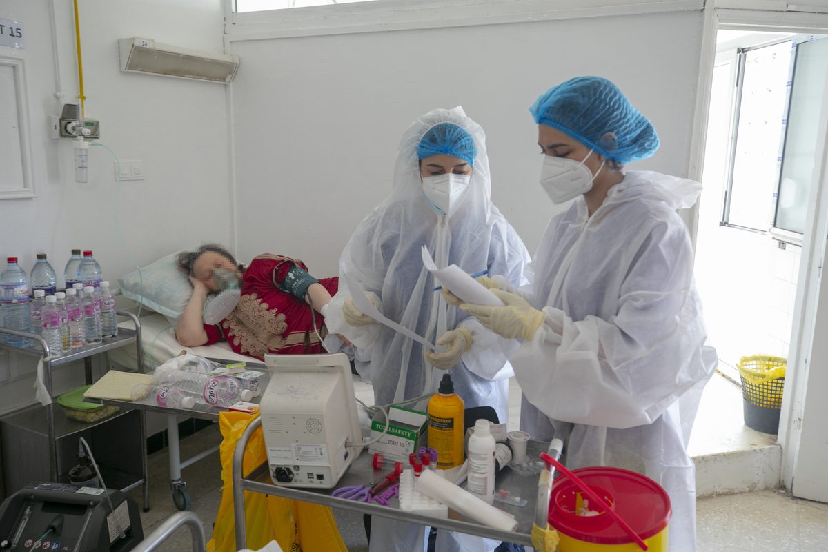 Healthcare professionals work at intensive care unit of Munci Selim Hospital, where Covid-19 patients are treated, as they spend Eid al-Adha next to their patients away from their families in Tunis, Tunisia on July 20, 2021 [Yassine Gaidi/Anadolu Agency]