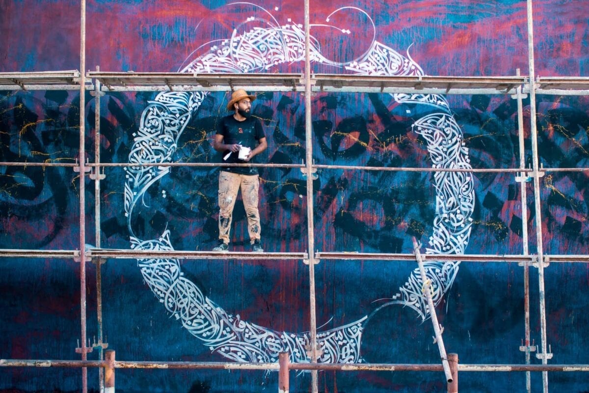 Belal Khaled works on his calligraffiti project [Majdi Fathi]