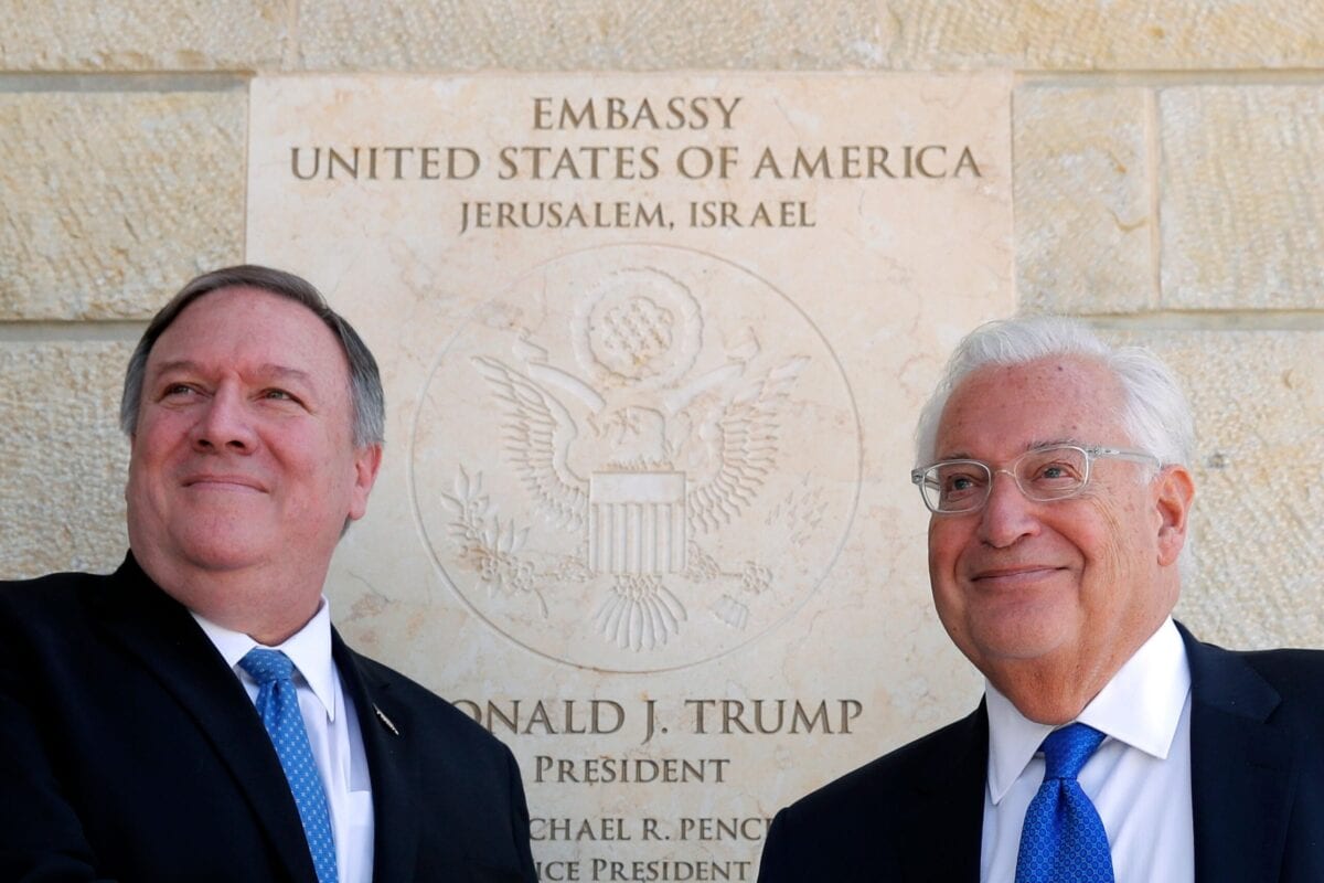 US Secretary of State Mike Pompeo (L) and US ambassador to Israel David Friedman stand next to the dedication plaque at the US embassy in Jerusalem on March 21, 2019 [JIM YOUNG/AFP via Getty Images]