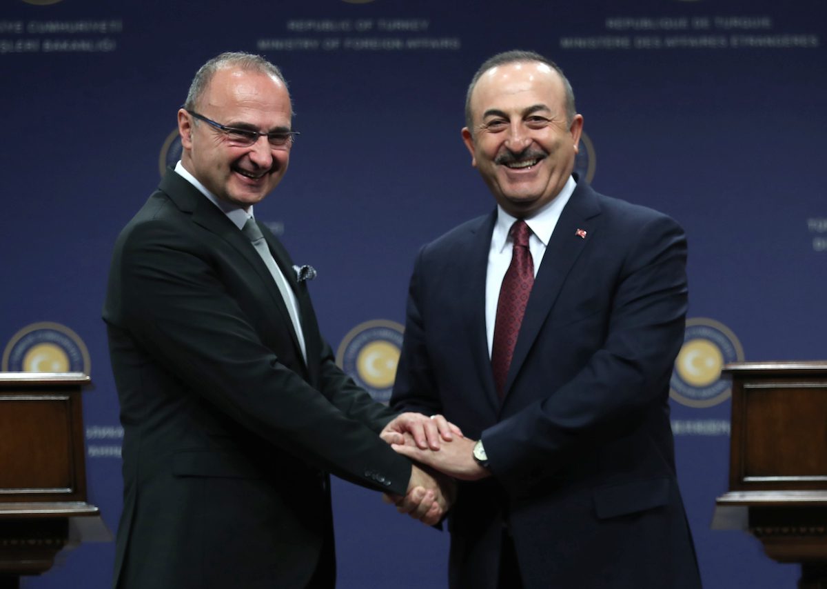 Croatia's Foreign and European Affairs Minister Gordan Grlic Radman (L) shakes hands with Turkish Foreign Minister of Turkey Mevlut Cavusoglu (R) prior to a press conference following their meeting in Ankara, on 11 December 2019. [ADEM ALTAN/AFP via Getty Images]