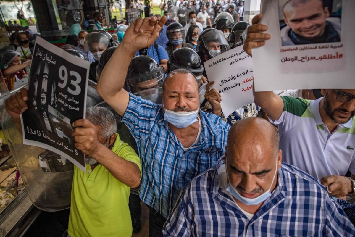 Moroccan Activists chant slogans during a protest demanding the release of Moroccan journalist Soulaimane Raissouni, who was sentenced to five years in prison for 'sexual assault', in the capital Rabat on July 10, 2021 [FADEL SENNA/AFP via Getty Images]