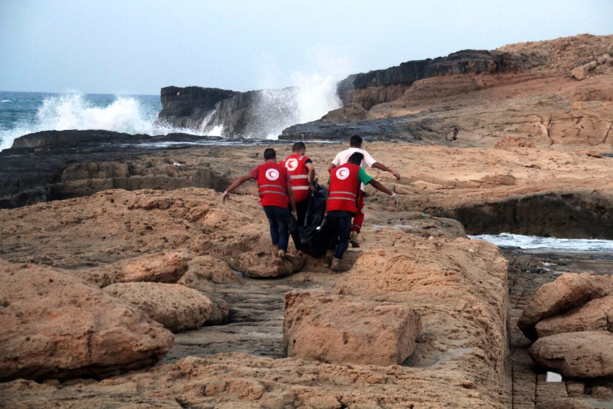 Libyan Red Crescent team members recover bodies of migrants who drowned at sea off the coast of the western city of Janzur on June 19, 2018 [STR/AFP via Getty Images]